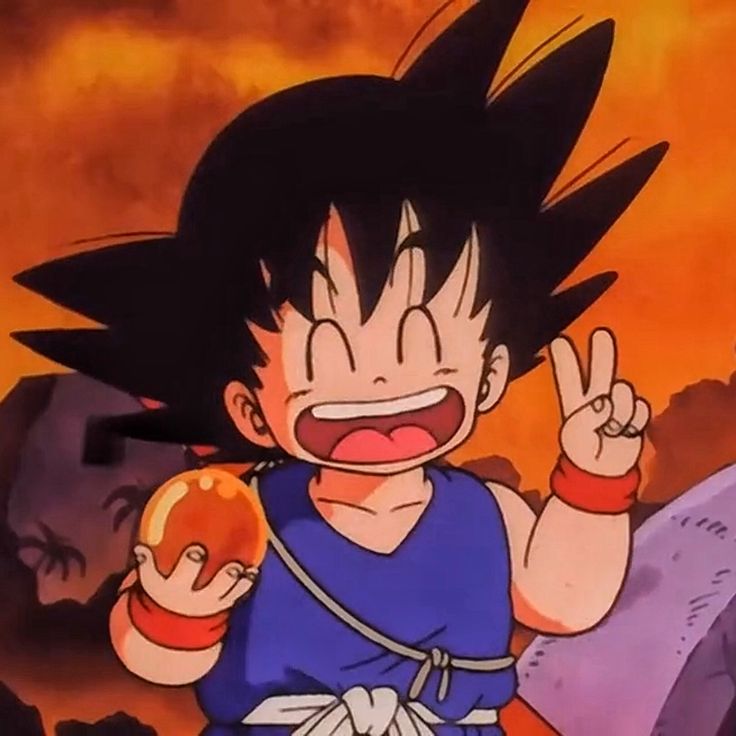 a young gohan holding an apple in his right hand and making the peace sign