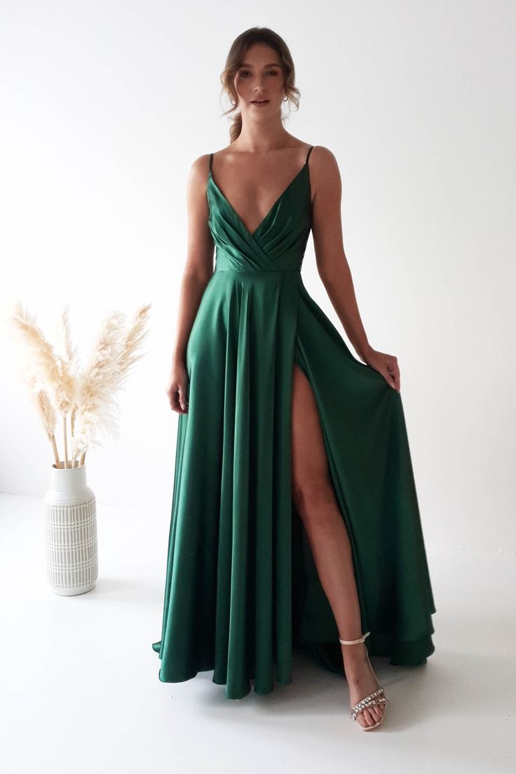 Velia Satin Maxi Gown | Emerald Green Sleeveless Green Dress With Lace-up Back, Green Sleeveless Dress With Lace-up Back, Green Dress With Corset Back And Fitted Bodice, Satin Maxi Dress With Tie Back, Prom Dress With Spaghetti Straps And Sweep Train, Fitted V-neck Gown With Corset Back, Fitted Tie Back Slip Dress For Prom, Fitted Slip Dress With Tie Back For Prom, Elegant Fitted Suspender Dress With Tie Back