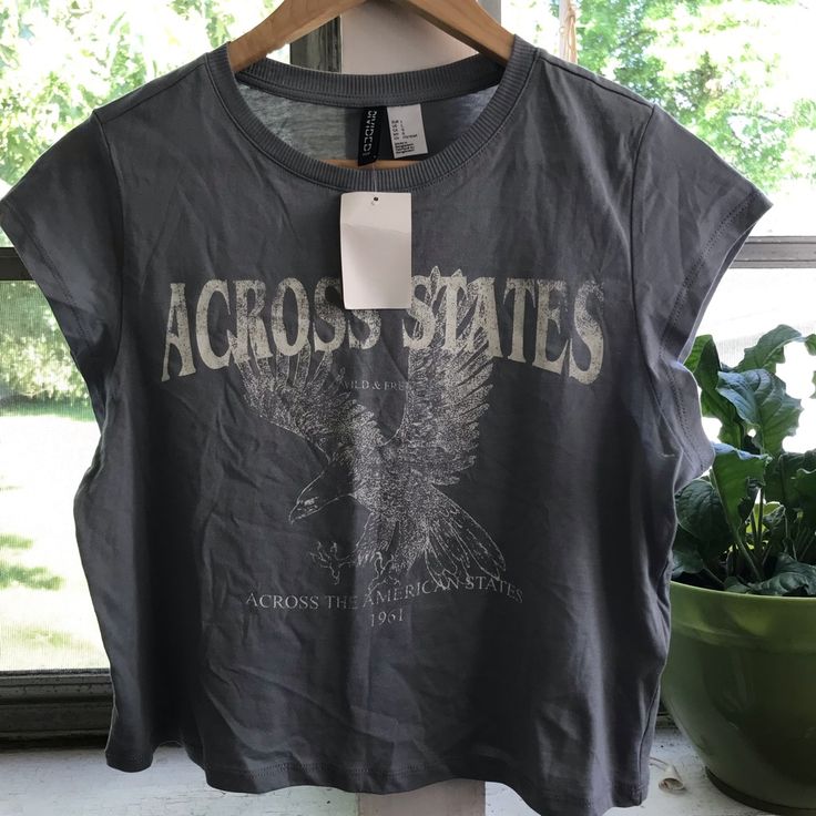 Divided H&M Gray Short Sleeve Graphic T Shirt, Size L H&m Graphic Print Tops For Spring, H&m Graphic Cotton T-shirt, H&m Cotton Crew Neck Top, H&m Fall Crew Neck Tops, H&m Crew Neck Tops For Fall, Gray Text Print Top For Summer, H&m Cotton T-shirt With Graphic Print, H&m Spring Graphic Tee Tops, Casual Cotton Tops By H&m