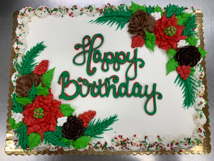 a decorated birthday cake with the words happy birthday written in green and red frosting