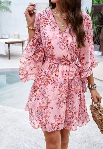 Chic Flowy Floral Dress For Garden Party, Feminine A-line Chiffon Mini Dress, Flowy A-line Floral Dress For Vacation, Flowy V-neck Summer Dress, Flowy A-line Mini Dress With Floral Print, Spring Feminine A-line Chiffon Dress, Chic Pink V-neck Chiffon Dress, Feminine A-line Floral Dress For Vacation, Flowy V-neck Floral Dress For Party