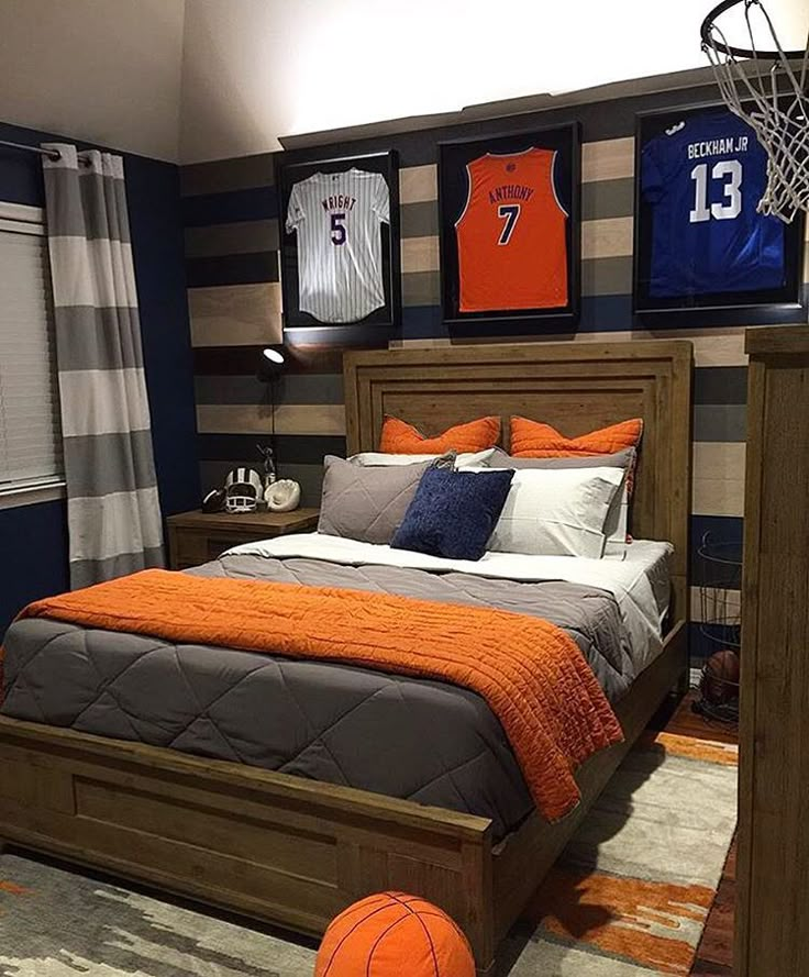 a basketball themed bedroom with orange and gray decor