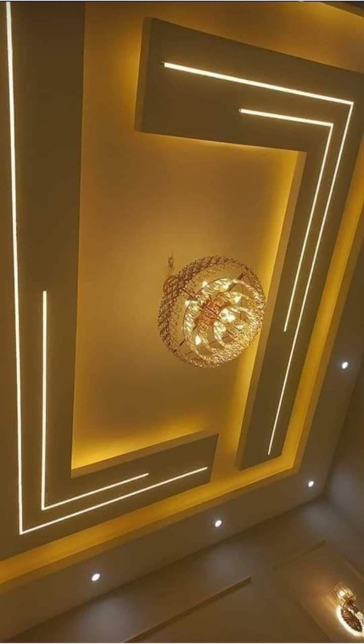 a ceiling with lights and a chandelier hanging from it