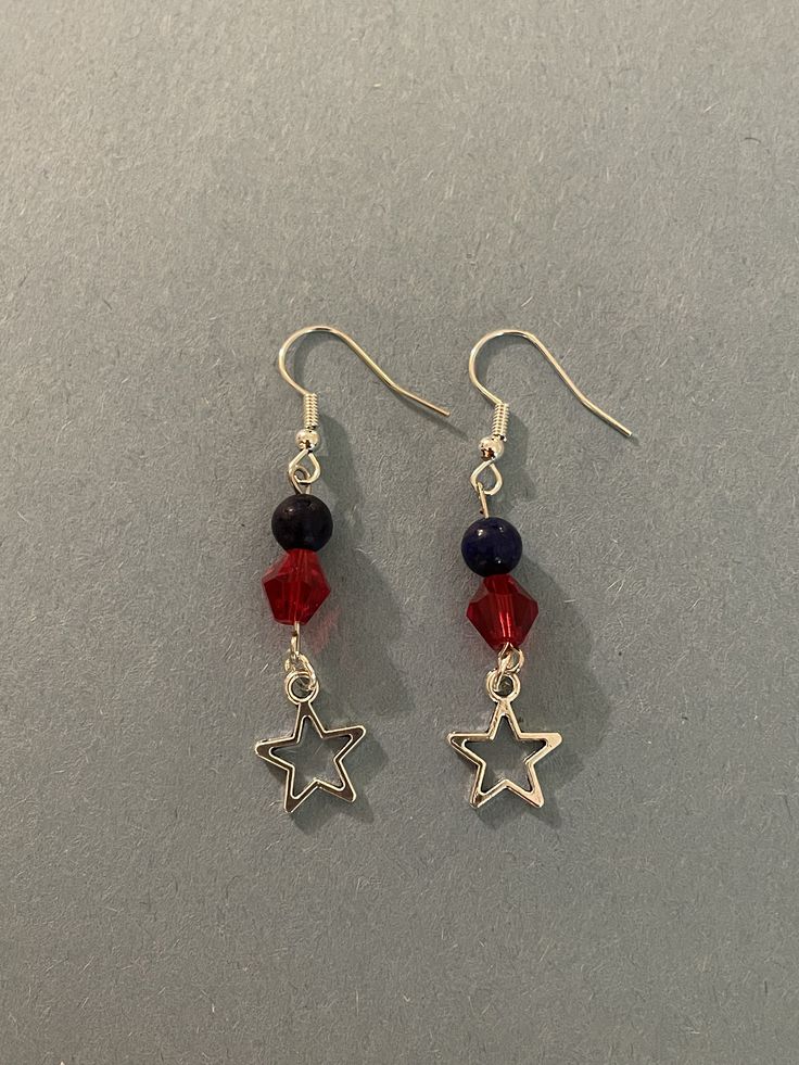 A beautiful patriotic earring set with a star center piece.  The red stone is crystal, the blue stone is jade.   Bracelets for Benjamin. Patriotic Red Star-shaped Earrings, Adjustable Red Patriotic Earrings, Patriotic Red Star Earrings, Patriotic Drop Earrings For 4th Of July, Patriotic Dangle Earrings For Independence Day, Patriotic Blue Dangle Jewelry, Patriotic Dangle Jewelry For Independence Day, Nickel Free Dangle Jewelry For 4th Of July, Adjustable Blue Jewelry For 4th Of July