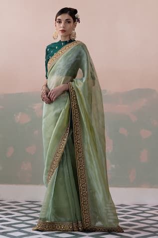 Green pure tissue silk saree with a sequin and thread hand embroidered border. Paired with a padded blouse with back tassel tie-up and petticoat. - Aza Fashions Embellished Saree, Tissue Silk Saree, Padded Blouse, Tissue Saree, Embroidered Border, Green Saree, Blouse For Women, Indian Fashion Designers, Silk Organza