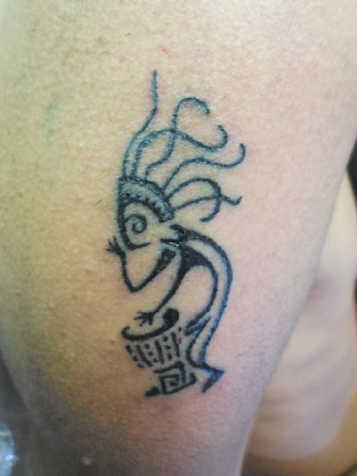 a person with a tattoo on their arm