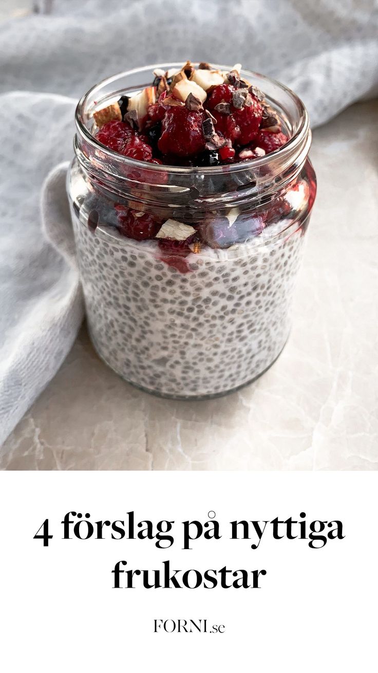 a jar filled with fruit and nuts on top of a table