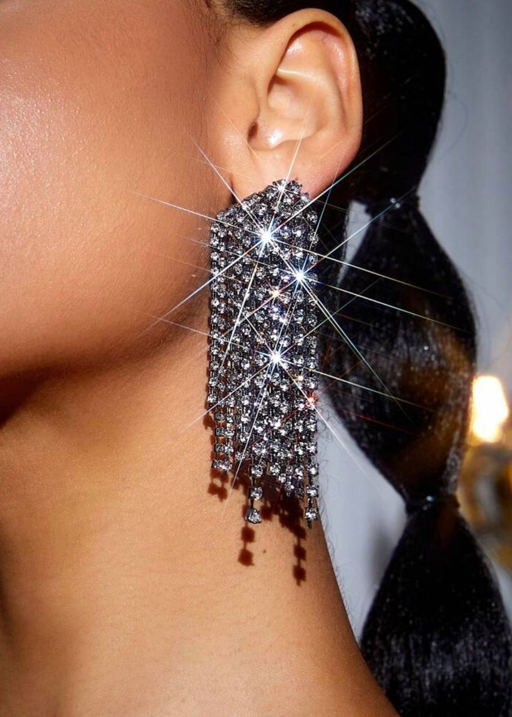 Experience elegance and glamour with our Zinc Alloy Rhinestone Tassel Earrings. Made with top-quality zinc alloy and adorned with sparkling rhinestones, these earrings are perfect for any special occasion or adding a touch of luxury to your everyday look. The tassel design adds a touch of movement and sophistication. Material: Zinc Alloy * Return and exchange are not supported Glamorous Alloy Jewelry For Party, Glamorous Tassel Earrings For Wedding, Glamorous Alloy Party Jewelry, Glamorous Silver Sparkling Crystal Earrings, Alloy Drop Earrings For Party, Alloy Earrings With Rhinestones For Party, Alloy Crystal Drop Earrings For Party, Elegant Alloy Earrings With Rhinestones, Party Alloy Crystal Drop Earrings