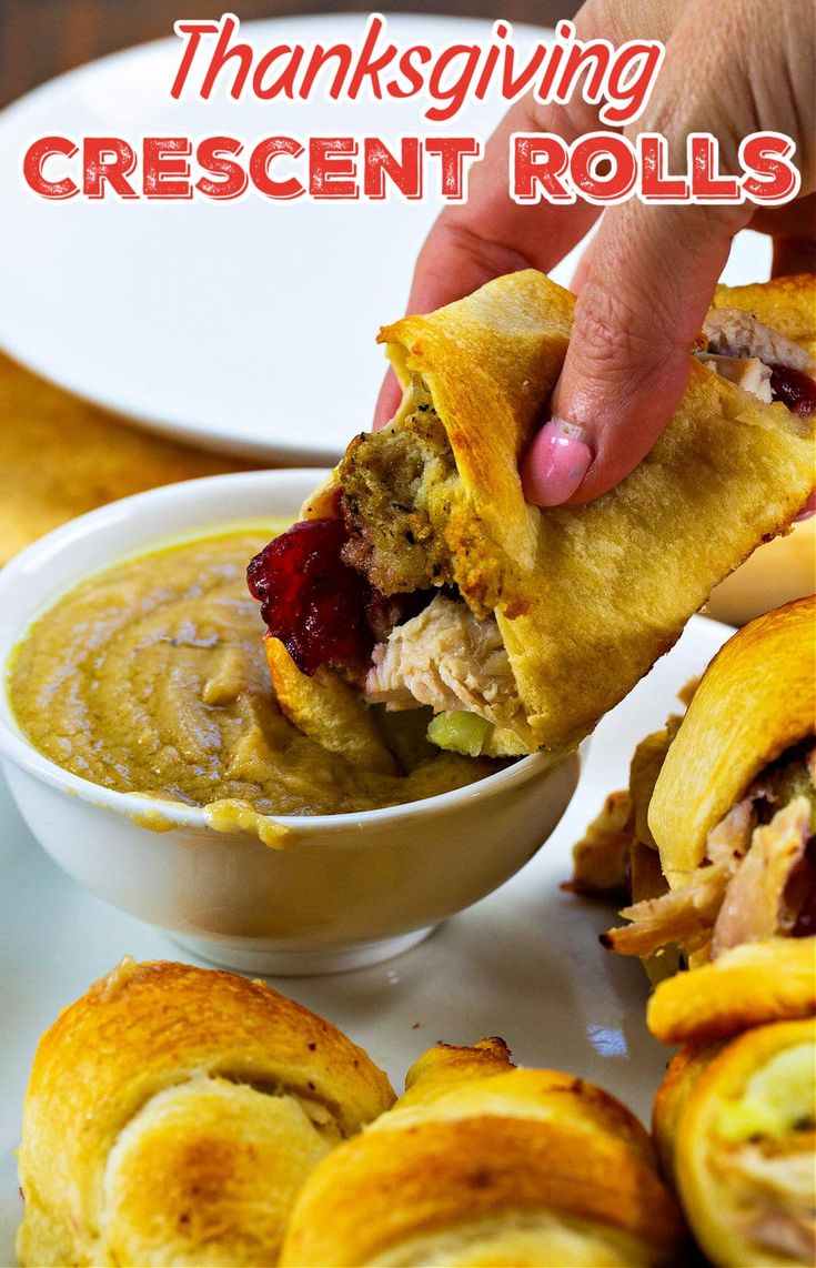 a hand dipping some food into a bowl with the words thanksgiving crescent rolls on it