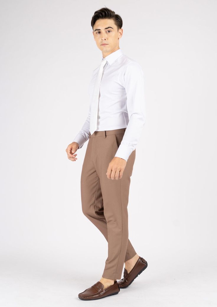 Experience the sophistication and comfort of these Light Brown Stretch Pants, crafted from premium stretch cotton and designed with a timeless classic style. Look effortlessly elegant without compromising on comfort in this custom made pants. Formal Fitted Cotton Bottoms, Tailored Straight Chinos For Business Casual, Classic Cotton Dress Pants For Semi-formal Occasions, Classic Semi-formal Cotton Dress Pants, Slim Fit Chinos For Business Casual, Slim Fit Cotton Dress Pants For Business Casual, Elegant Chinos For Workwear With Straight Hem, Classic Elastane Pants With Straight Hem, Fitted Cotton Work Pants For Business Casual