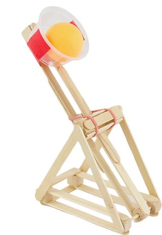 a wooden toy with a light on top of it's head and an object in the back