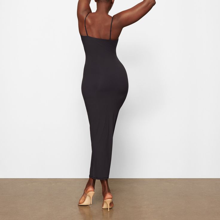 Everything you love about our signature Fits Everybody collection, now in an ultra-flattering dress. This double-lined silhouette is made to hug your body and offer a snatched, smoothed look. Fits true to size. | SKIMS Long Slip Dress | Black | 2XS | Fits Everybody Fitted Maxi Dress With Built-in Bra For Date Night, Midi Bodycon Dress With Built-in Bra For Date Night, Stretch Midi Dress With Built-in Bra For Date Night, Elegant Fitted Bodycon Dress With Built-in Bra, Fitted Longline Midi Dress For Date Night, Fitted Midi Dress With Built-in Bra, Fitted Longline Midi Dress For Night Out, Fitted Longline Maxi Dress For Date Night, Bodycon Dress With Built-in Bra For Date Night