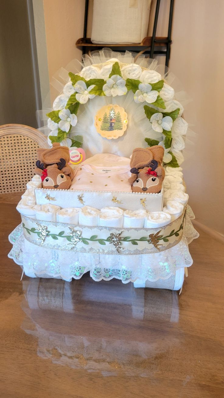 a baby crib cake with teddy bears on it