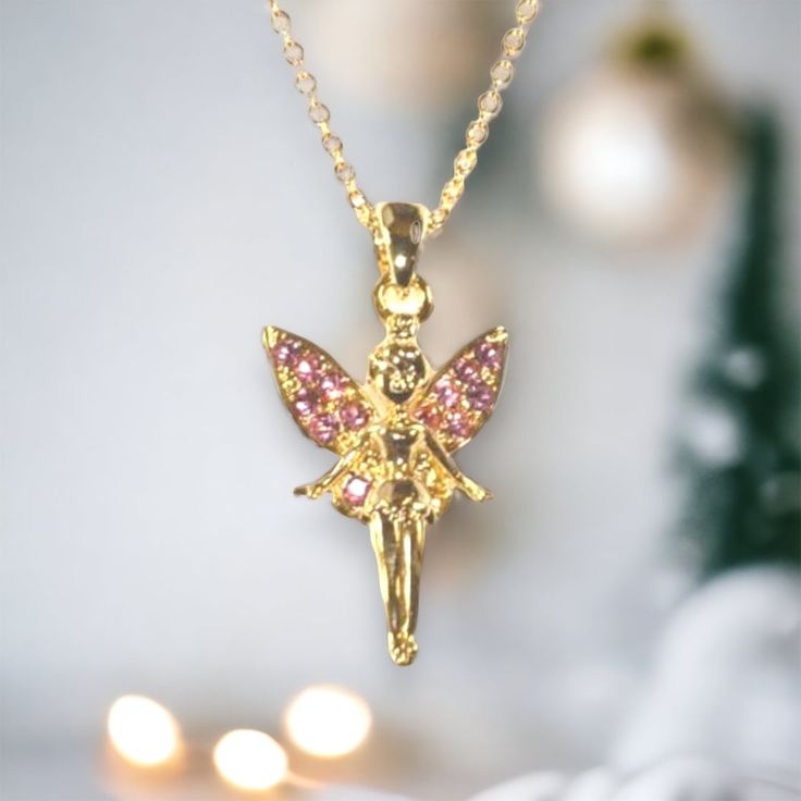 This fairy princess gold necklace is beautifully crafted with pink jewels on the wings. A fabulous gift idea. Gold chain. Suitable for children age 3 and over. Chain length 71/2 in. Baby Bible, Earth Baby, Pink Jewels, Fairy Necklace, Fairy Princess, Fairy Princesses, Mini Wallet, Girls Jewelry