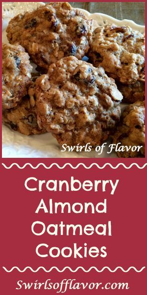 cranberry almond oatmeal cookies on a white plate with red border