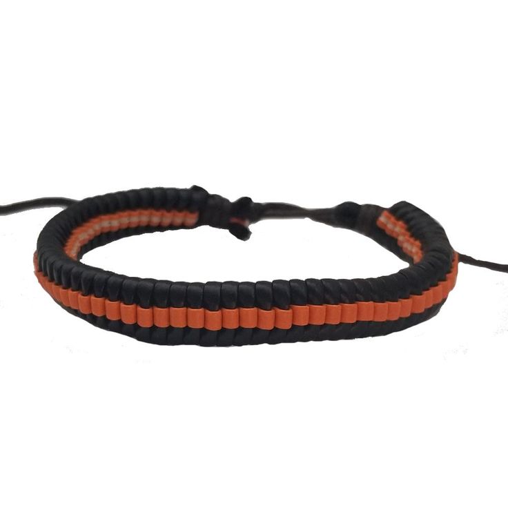 If you like orange and black, then this simple bracelet is perfect for you to add to your collection. The bracelet is adjustable via a sliding knot. Product Information Material: PU leather Clasp Type: rope (sliding knot) Adjustable: 6.5 inches to 8 inches Adjustable Orange Jewelry For Friendship, Adjustable Orange Jewelry For Everyday Wear, Adjustable Orange Everyday Jewelry, Adjustable Orange Friendship Bracelets, Handmade Orange Casual Friendship Bracelet, Casual Handmade Orange Friendship Bracelets, Casual Handmade Orange Friendship Bracelet, Handmade Adjustable Orange Friendship Bracelets, Adjustable Bangle Wristband For Friendship