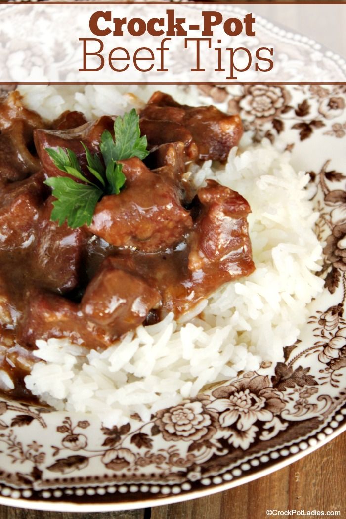 crock pot beef tips served over white rice on a brown and white patterned plate