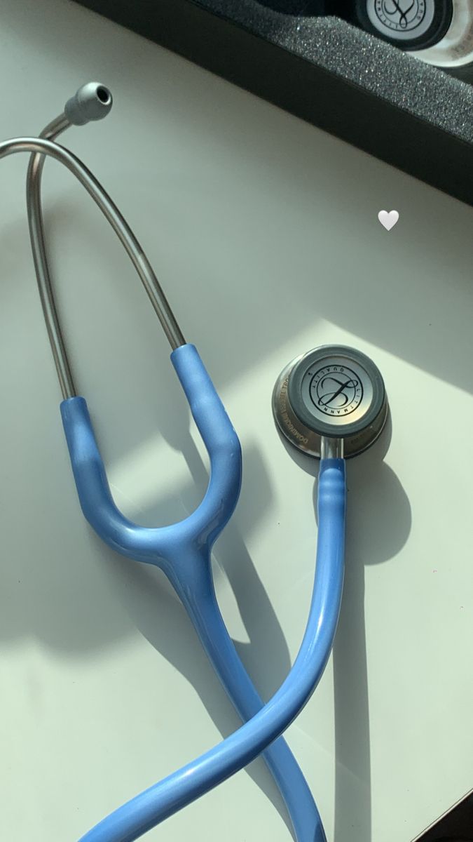 a blue stethoscope sitting on top of a table