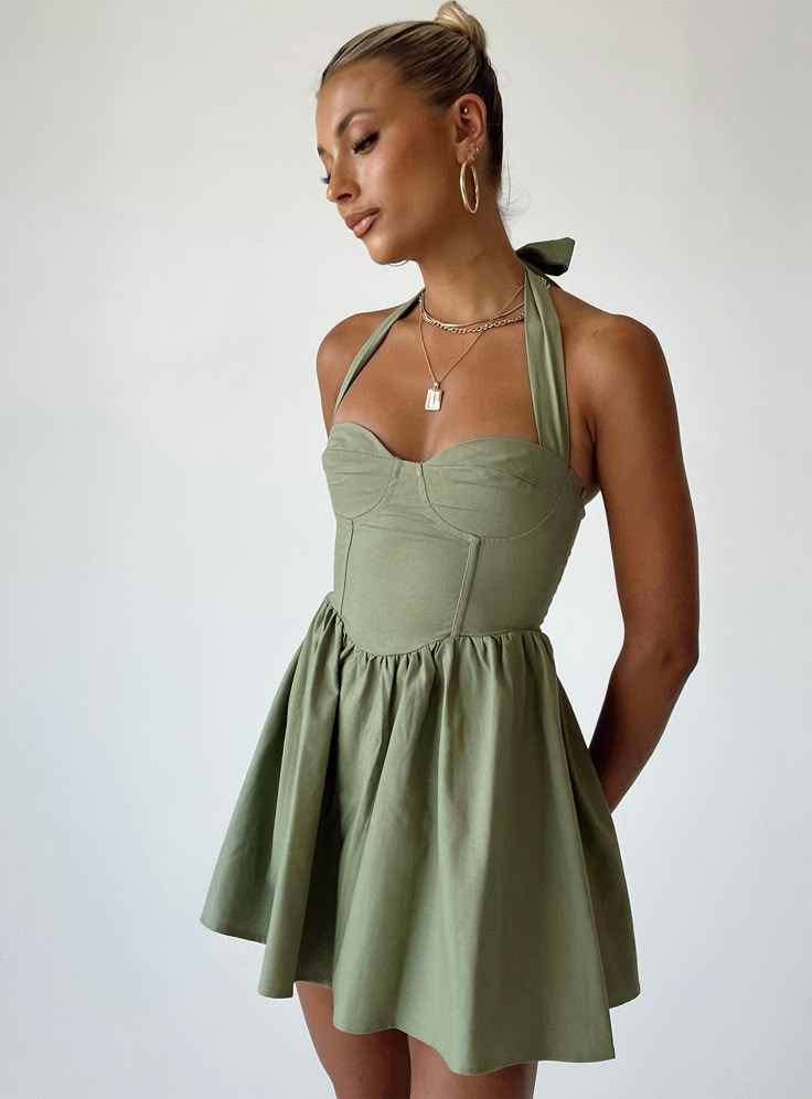 Mini dress Halter neck tie fastening  Stitched bust  Invisible zip fastening at back  Gathered waist Mini Dress Princess Polly, Green Halter Dress, Sage Green Dress, Sage Dress, Dress Sage, Brunch Dress, Asymmetrical Hem Dress, Polly Dress, Mini Dress Fashion