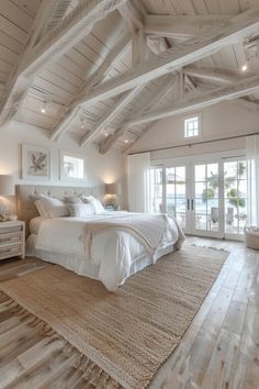 a large bed sitting inside of a bedroom on top of a wooden floor