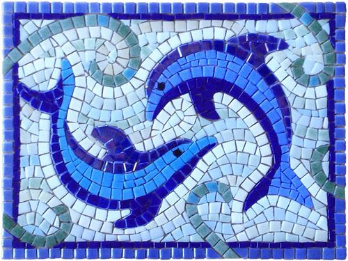 a mosaic tile with dolphins on it