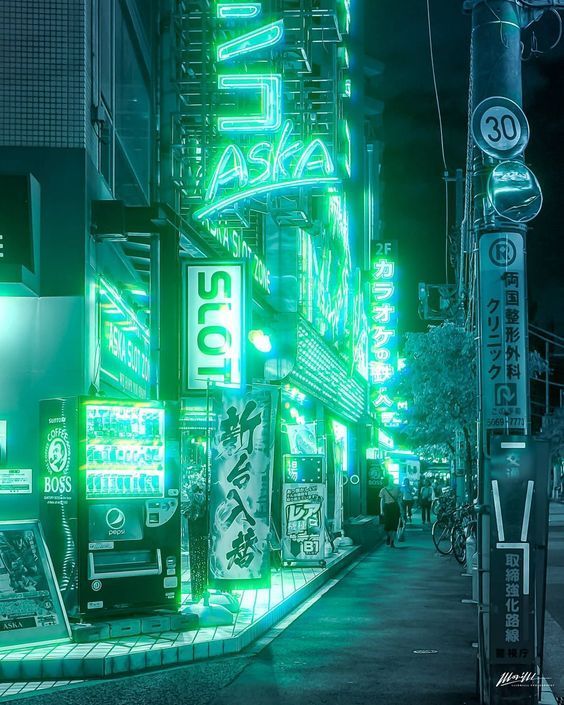 a city street filled with lots of neon signs