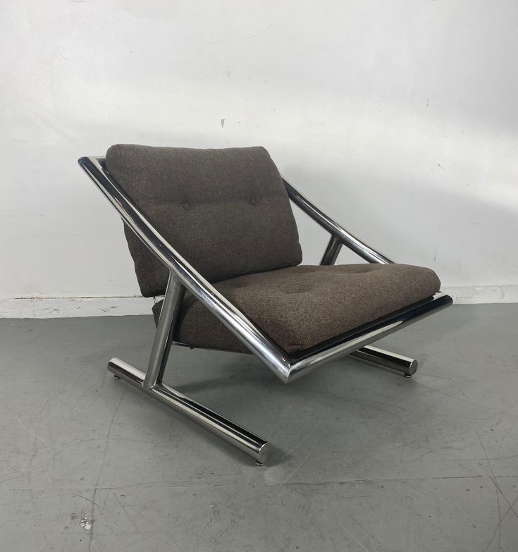 a brown chair sitting on top of a cement floor