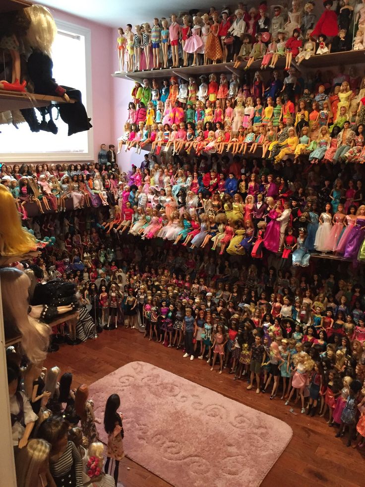 a room filled with lots of dolls and toys