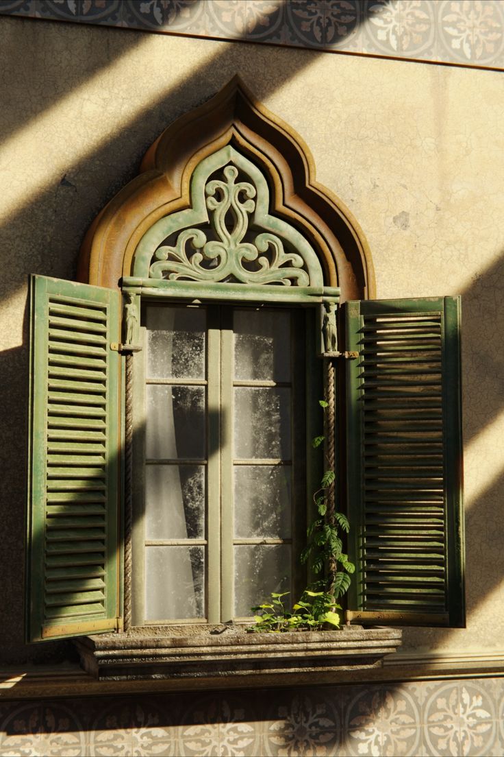 an open window with green shutters on the outside