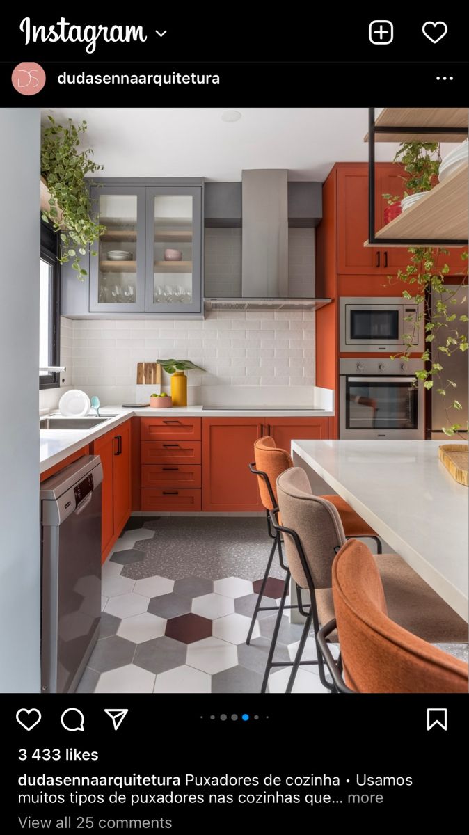 a kitchen with orange cabinets and white counter tops