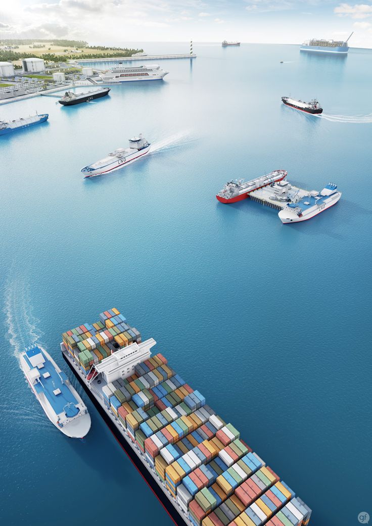 an aerial view of a large container ship in the ocean with several smaller boats nearby