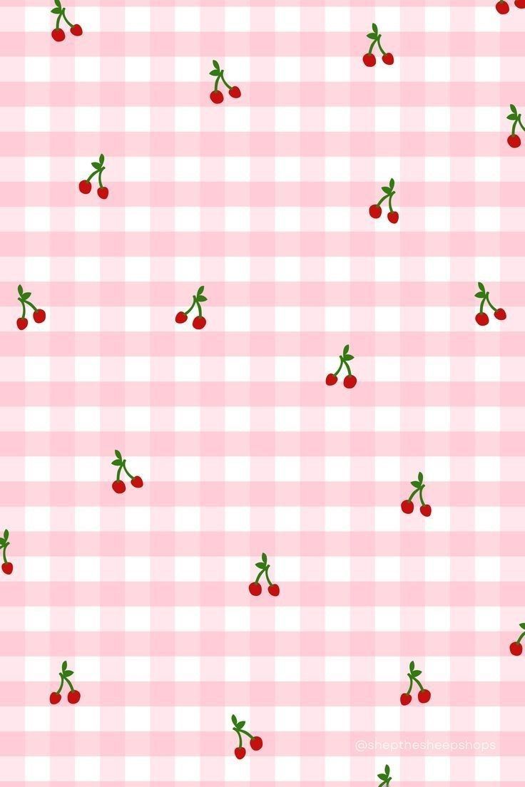 a checkered table cloth with cherries on it