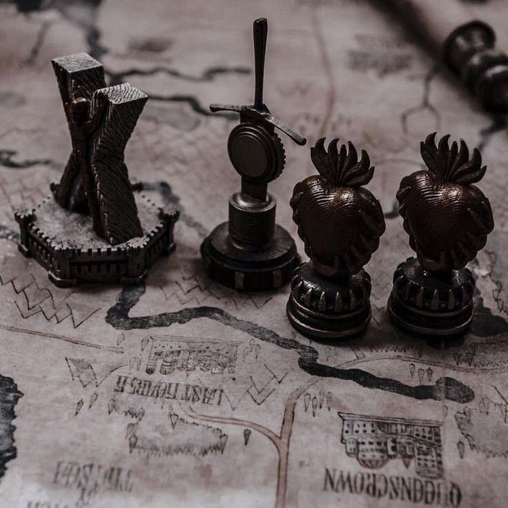 a close up of some chess pieces on a map