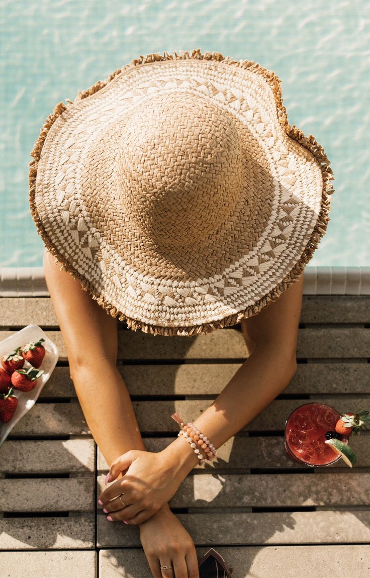 Ok, this one is stunning! The Sangria is a rounded head, casual beach style woven straw hat with raw edges, AND added, may we say, exquisite braiding and woven pattern trim. So cutie! MMT8264 Vince Camuto Straw Hat, Vacation Straw Hat With Woven Details, Casual Sun Hat With Fringe, Chic Woven Sun Hat For Vacation, Brimmed Woven Straw Hat For Vacation, Woven Straw Sun Hat For Vacation, Woven Brimmed Straw Hat For Vacation, Woven Sun Straw Hat For Vacation, Bohemian Straw Hat For Vacation Warm Weather