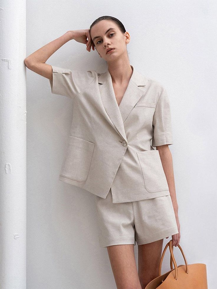 Editor's NotesThe summer patns is cut from herringbone patterned linen and upgrades your summer outfit- Classic shorts- Matte cow horn button- Button closure with zip flt- Side pockets- Set up with Herringbone Puffed Half Sleeve JacketMeasuremets(in.)- S:       Waist     27.4in.,        Hip     37.1in.,        Length     14.6in.              - M:        Waist     29.4in.,        Hip     39in.,        Length     15in.              - L:        Waist     31.9in.,        Hip     41in.,        Length     15.4in.  *Model size- Height 176cm-        Bust     31.2in.,        Waist     24.5in.,        Hips     33.9in.  Composition & Care- 55% Polyester, 14% Linen, 28% Cotton, 3% Polyurethane- Dry cleaningDesigner- Made in Korea- by RE RHEE Beige Linen Shorts For Work, Spring Linen Shorts With Welt Pockets, Beige Patch Pocket Shorts For Summer, Beige Summer Shorts With Patch Pockets, Spring Beige Shorts With Patch Pockets, Linen Workwear Shorts With Welt Pockets, Linen Shorts With Welt Pockets For Work, Summer Workwear Bottoms With Buttoned Pockets, Neutral Workwear Shorts With Pockets