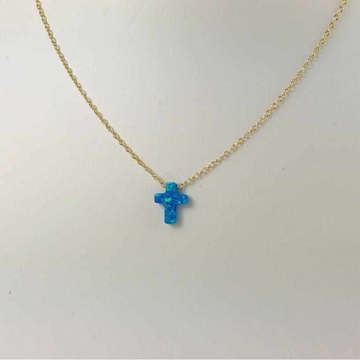 Description Simple. Chic. Minimalist™ A perfectly dainty brilliant synthetic fiery blue opal cross is floating freely on a delicate feminine 14k gold plated over Sterling silver chain. This cute and tiny star charm necklace features a synthetic created blue opal moon stone with sterling silver chain. This lovely star necklace is perfect for complementing a casual outfit, and you can even layerbit with other necklace to create something unique. * High Quality 925 Sterling Silver link chain with s Blue Opal Cross Necklace, Blue Cross Necklace, Opal Clavicle Chain Jewelry Gift, Opal Jewelry With Delicate Chain As Gift, Delicate Opal Chain Jewelry Gift, Delicate Opal Chain Jewelry As Gift, Delicate Opal Chain Jewelry For Gifts, Nickel-free Blue Opal Jewelry, Blue Opal Nickel-free Jewelry