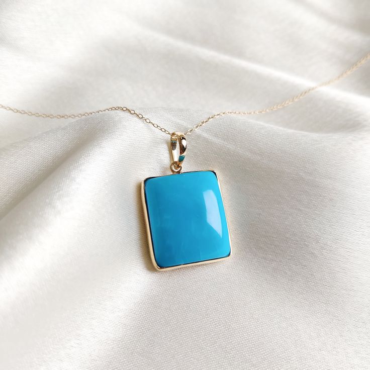 This stunning pendant is set in 14K Solid Yellow Gold with Natural Sleeping Beauty Arizona Turquoise with utmost precision. It is an unique gemstone pendant for nearly every occasion and is completely hassle-free jewelry. ITEM DETAILS * Gem: Turquoise * Gem Size: 17X20mm * Gem Shape: Rectangle Cab  * Gem Weight: 30.52 carats * Gold Purity: 14KT  * Gold Weight: 1.442 gram * Total Weight of the Pendant: 7.546 gram The Gold purity is guaranteed and it comes with authentic 14KT gold hallmark. Since my items are handmade, they are absolutely nickel and lead free. CUSTOMIZATION * Gemstone customization is available and it can be substituted with a gem of your choice. Kindly message me for the same. PACKAGING * The Pendant comes with layers of safe and secure wrapping along with Free handmade jew Elegant Turquoise Necklace With Rectangular Pendant, Turquoise 14k Gold Fine Jewelry, Fine Jewelry In 14k Gold With Turquoise, 14k Gold Turquoise Fine Jewelry, 14k Gold Turquoise Necklace For Gift, Fine Jewelry Turquoise Pendant Necklace, Fine Jewelry Turquoise Pendant Necklace Gift, Turquoise Gemstone Rectangular Pendant Jewelry, Blue Turquoise Gemstone Necklace Fine Jewelry