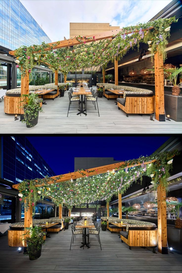 an outdoor dining area is decorated with greenery and lights