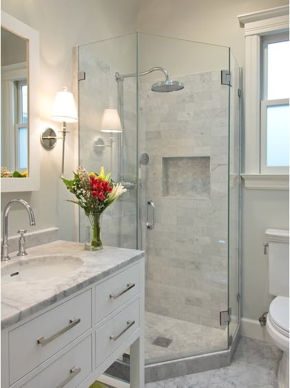 a bathroom with a sink, toilet and shower