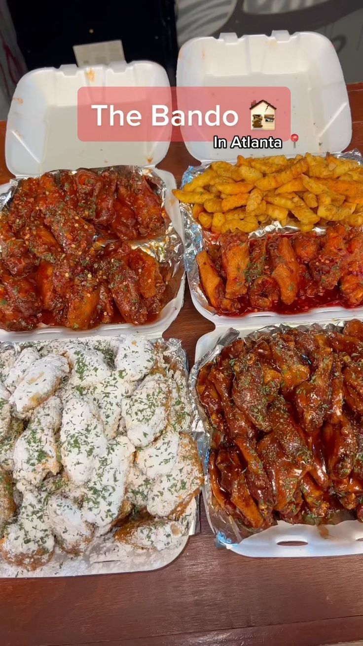 four containers filled with different types of food on top of a wooden table in front of a sign that says the bando