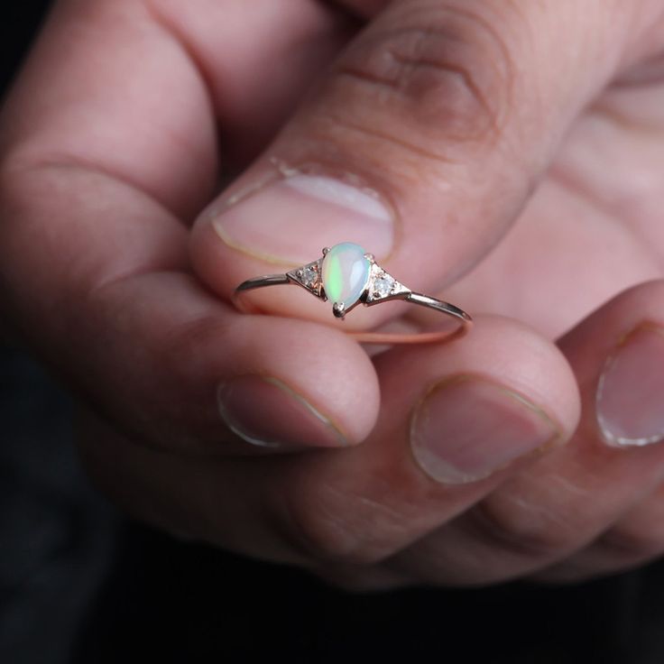 ⚫ This ring made with natural pave diamond & opal in solid 14k rose gold, ⚫ Solid 14k Gold Pave Diamond Opal Ring Handmade Pure Gold Jewelry. ⚫ Diamond Ring, Opal Ring, Engagement Ring, Wedding Bands, Gold Ring, Gemstone Ring ⚫ Special customize for Anniversary, Birthday Gift, Valentine, Mother's Day Christmas. ⚫ Item Details: Gross Weight :- 1.03 Grams 14k Rose Gold Weight :- 0.96 Grams Diamond Weight :- 0.03 Carats Opal Weight:- 0.30 Carats Ring Size 7 ( can be customized) Item SKU: YTR-21 Delicate Diamond Wedding Jewelry, Wedding Diamond Jewelry, Delicate 14k Rose Gold Wedding Jewelry, Delicate 14k Rose Gold Wedding Rings, Delicate Wedding Rings In 14k Rose Gold, Delicate Opal Wedding Ring, 14k Gold Opal Ring For Wedding, Delicate 14k Gold Opal Ring For Anniversary, Dainty Opal Ring For Wedding With Round Cut