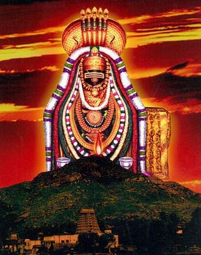 an image of the god sitting on top of a hill with sunset in the background