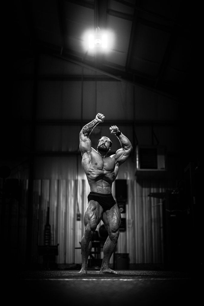 a bodybuilding man flexing his muscles in the gym