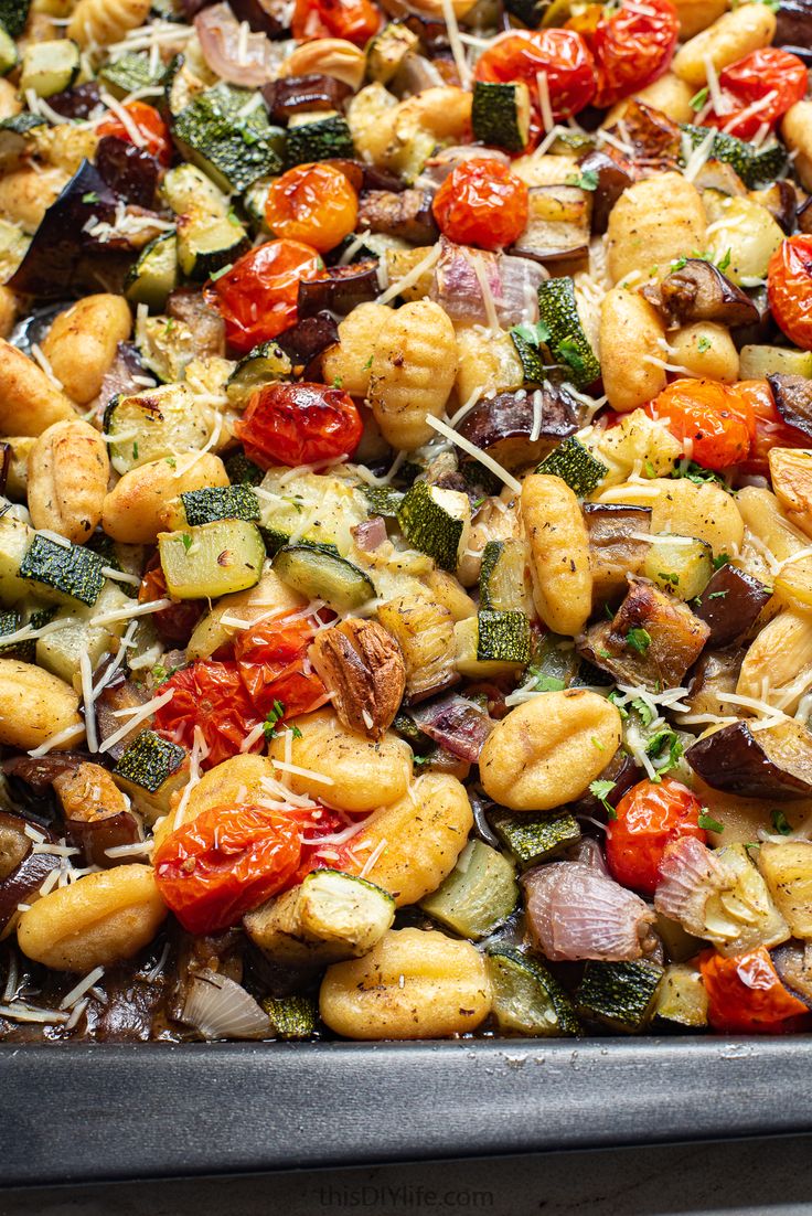 a tray filled with lots of different types of food on top of a stovetop