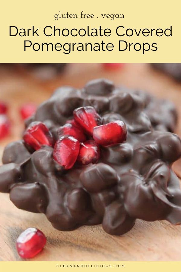 chocolate covered pomegranate drops on a cutting board with text overlay that reads, dark chocolate covered pomegranate drops