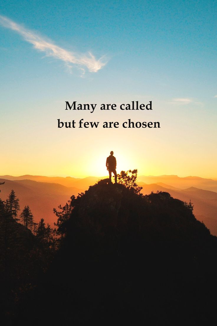 a person standing on top of a mountain at sunset