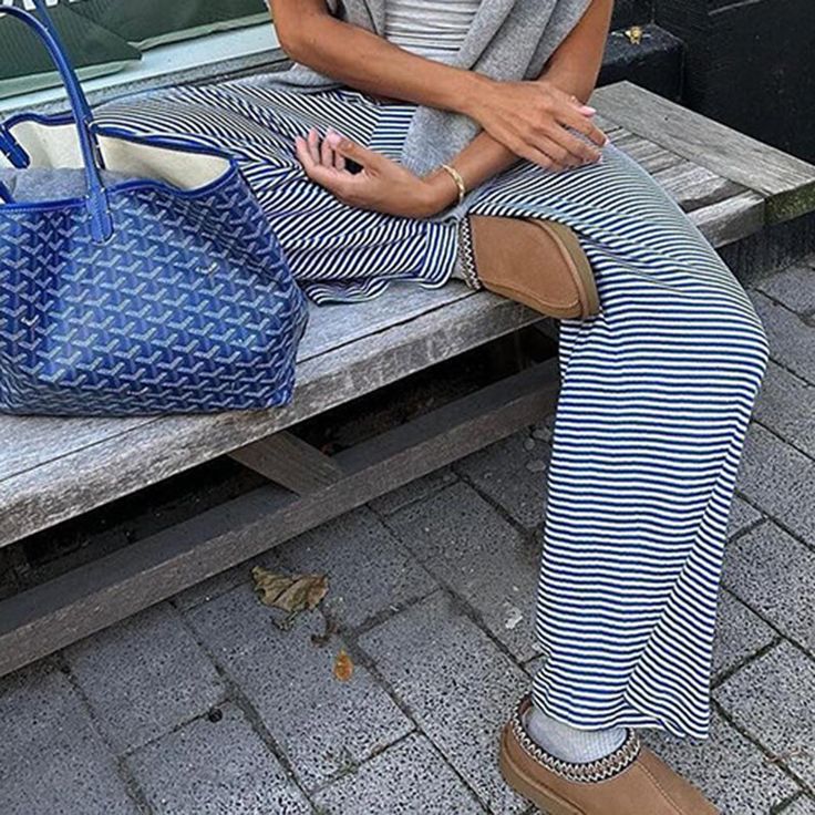 Relax in style with the Noora Striped Lounge Pants. Featuring a classic striped pattern, these pants are perfect for laid-back days at home or casual outings. The wide-leg silhouette and drawstring waistband ensure a comfortable, adjustable fit. Crafted from soft, breathable fabric, these lounge pants provide the perfect blend of style and ease for a cozy yet chic look. Details: Timeless striped design for a casual, relaxed vibe Soft and breathable fabric for all-day comfort Wide-leg fit and dra Casual Wide Leg Bottoms With Striped Hem, Chic Vertical Stripes Loungewear Bottoms, Casual Wide-leg Pants With Vertical Stripes, Casual Ankle-length Pants With Vertical Stripes, Casual Ankle-length Bottoms With Vertical Stripes, Striped Wide-leg Pants For Day Out, Casual Striped Ankle-length Wide Leg Pants, Casual Wide Leg Ankle-length Striped Pants, Casual Striped Wide Leg Lounge Pants