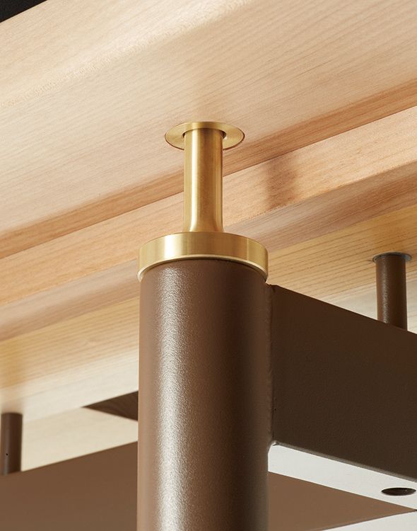 a close up of a light fixture on a ceiling in a room with wood paneling