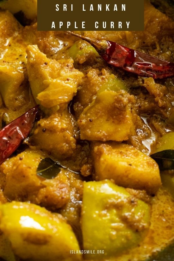 a close up of food in a pan with the words sri lankan apple curry