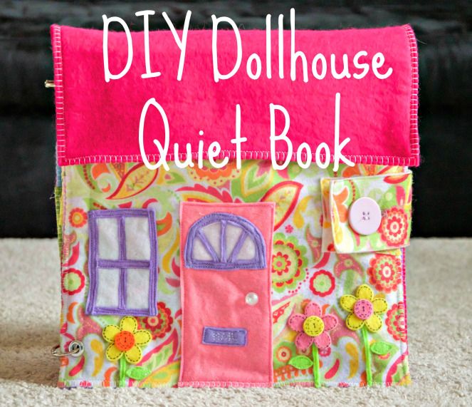 the diy dollhouse quiet book is made out of fabric and has a pink door